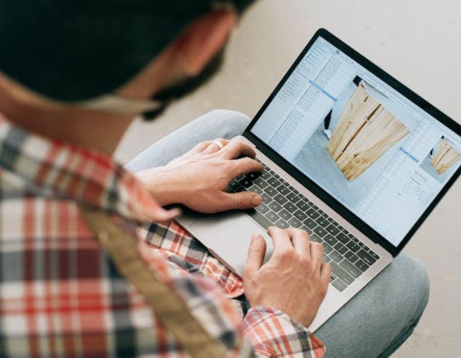 a man analysing a product on a macbook