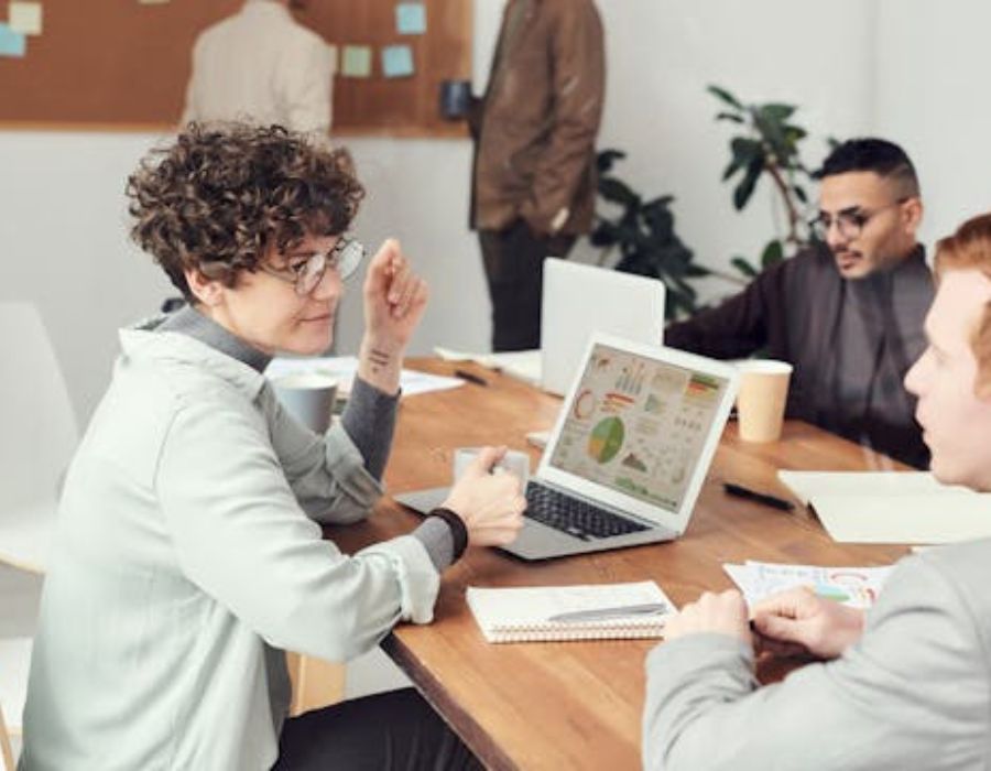 a woman explain something to the others