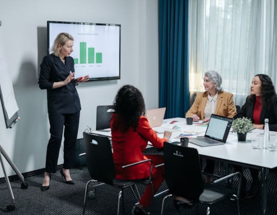 a woman doing a presentation on a graph