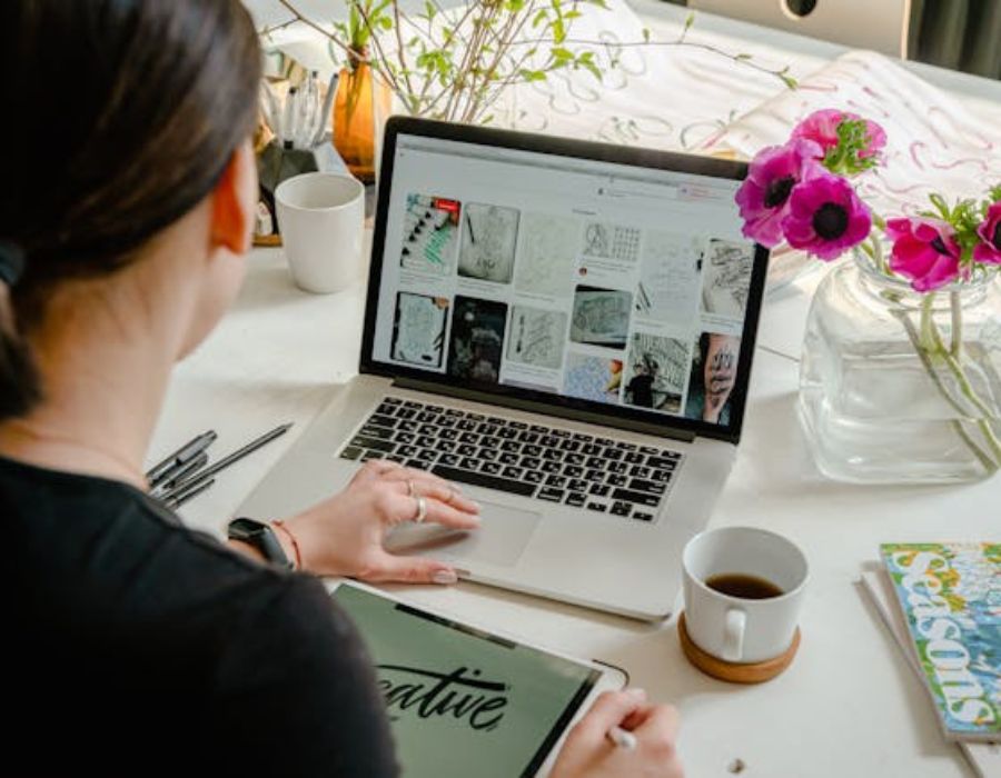 a Person Using Laptop For Graphic Designs