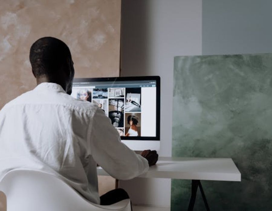 a man browsing through some content on the computer