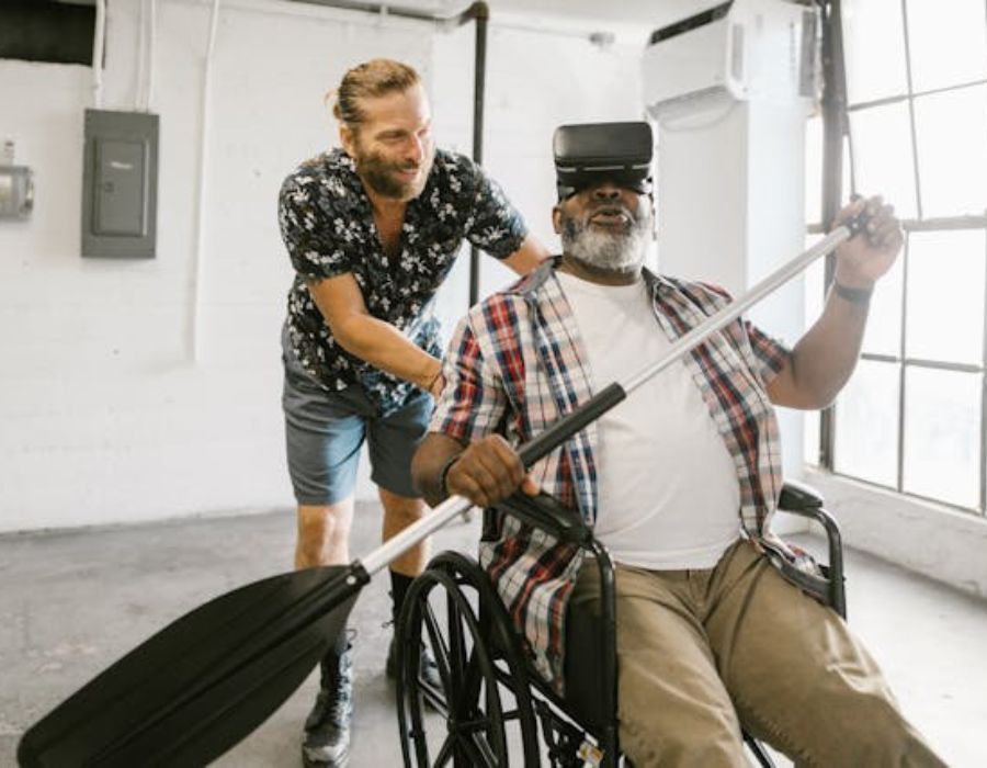 Man Helping a Man Play with Virtual Reality Headset