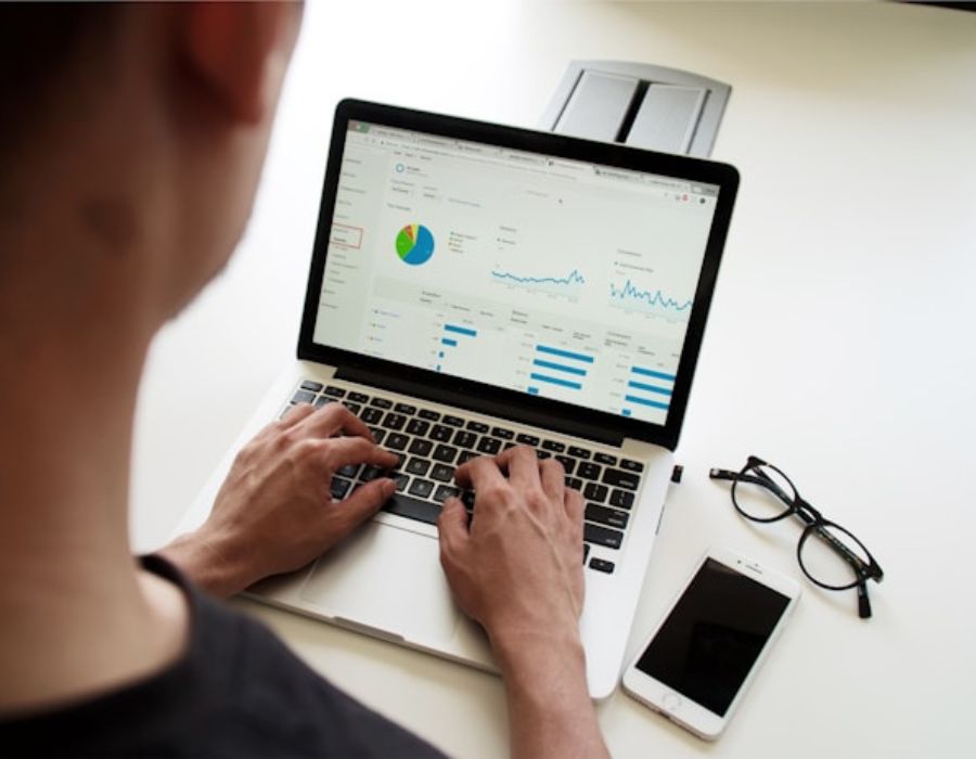 a person analysing something on a computer