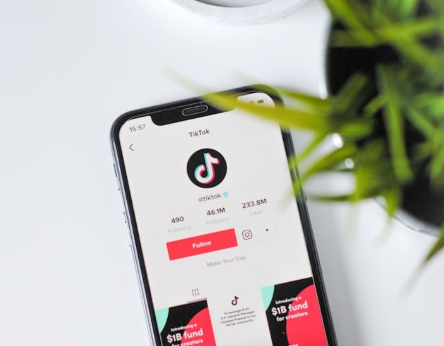 a smartphone with the TikTok app open displaying content