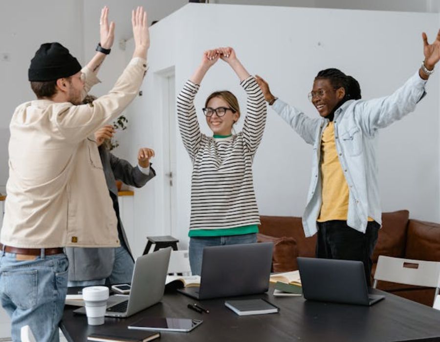 A Group of People Celebrating Together at Work