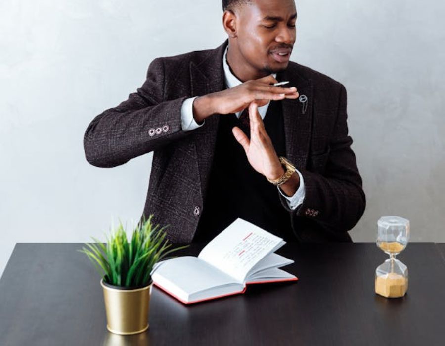 a man looking at his hourglass before taking a break
