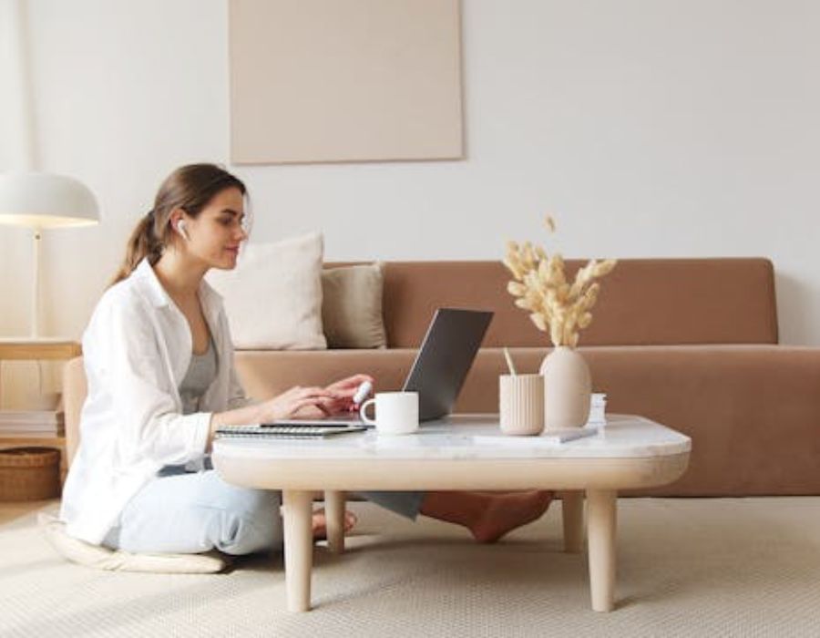 A woman using a laptop ata home
